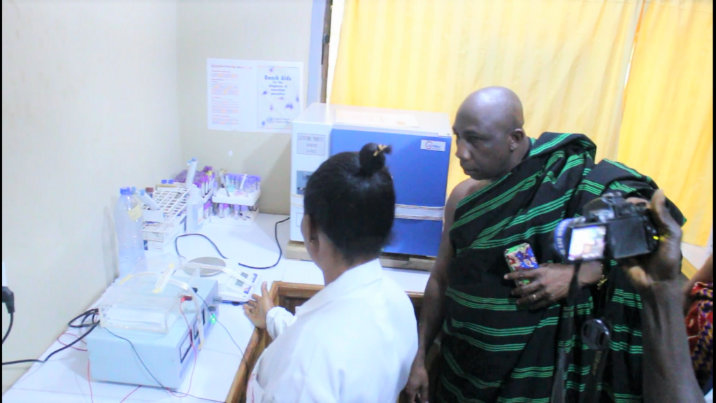 Odeneho Dr. Afram Brempong Omanhene Suma Traditional area inspecting an equipment