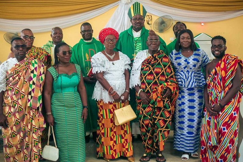 Sir Stephen and Mrs. Felicia Adzamli in a group photo with family and the clergy