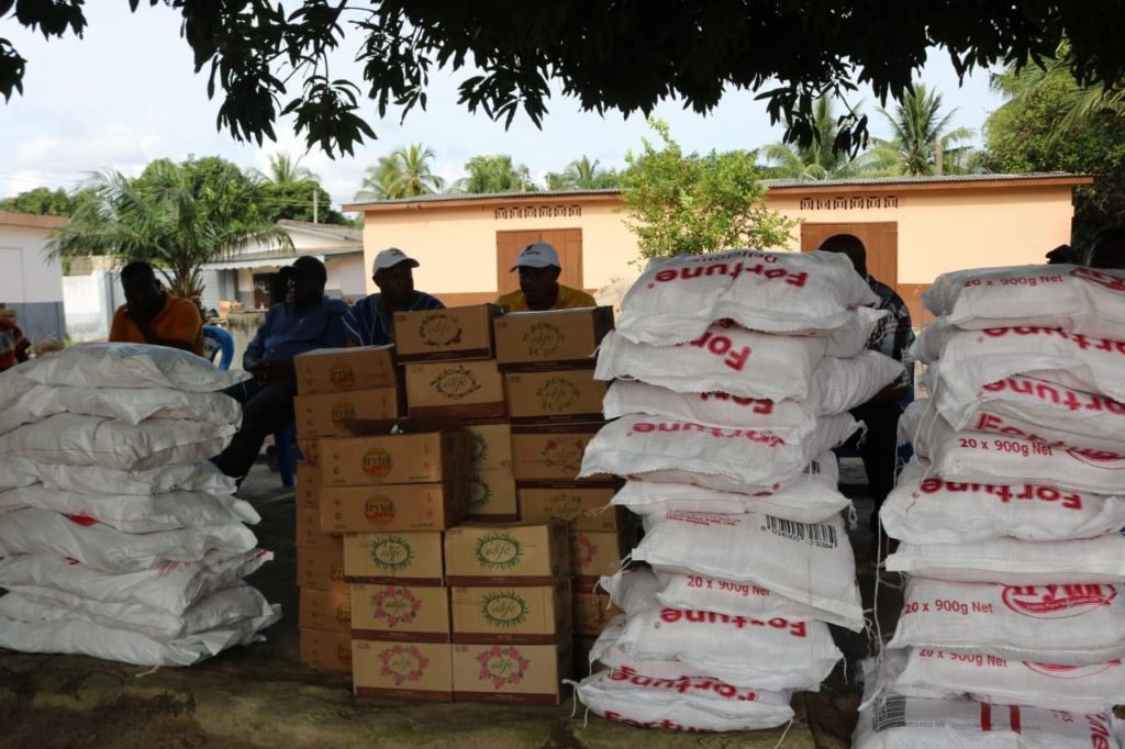 Torgbuigah Adzonugaga Amenya Fiti and Welmah Ghana distribute relief items to flood victims in Ketu South