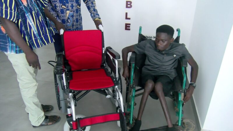 Student who pushes himself 26km weekly to lectures receives 2 electronic wheelchairs, scholarship after JoyNews report
