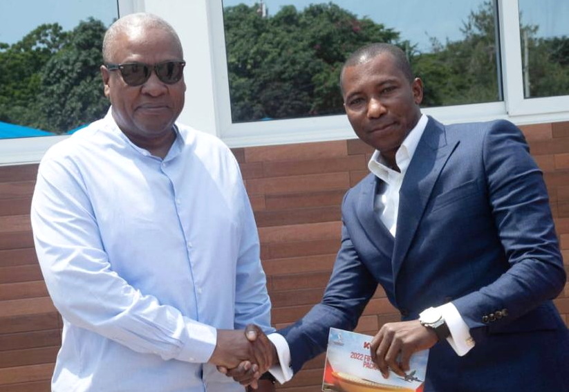 Kennedy Agyapong, right, in a handshake with President Mahama