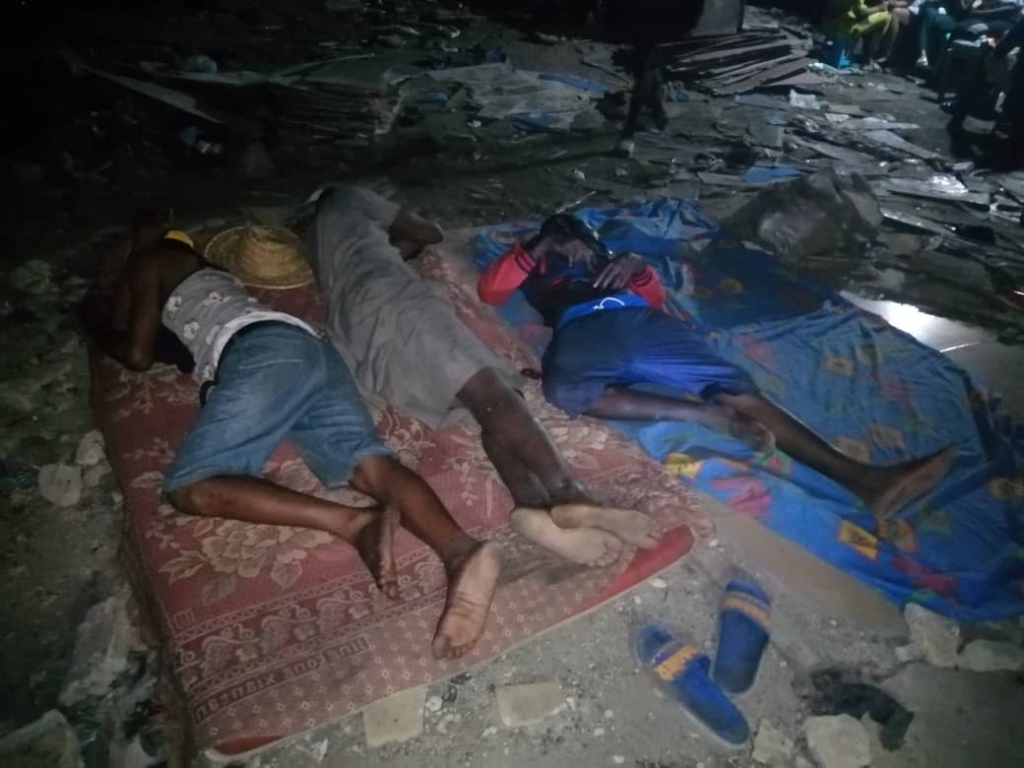 Squatters at Old Fadama sleep in the open after city authorities demolish their makeshift homes
