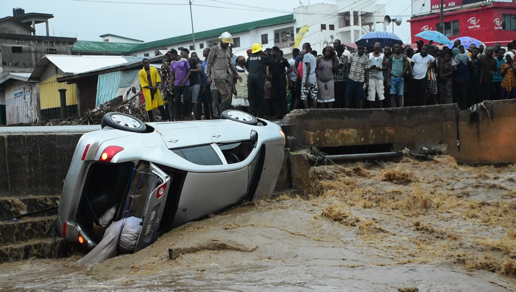 4 rescued after floodwaters carried vehicle into storm drain