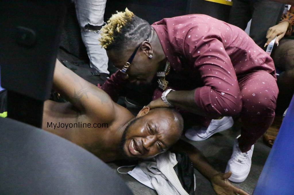 Photos of driver who abandoned his passengers to follow his idol Shatta Wale