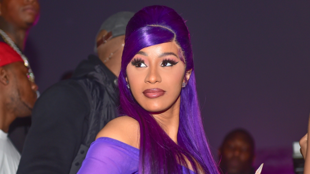 Cardi B wore a neon blue wig with puzzle piecestyle highlights to a haunted house