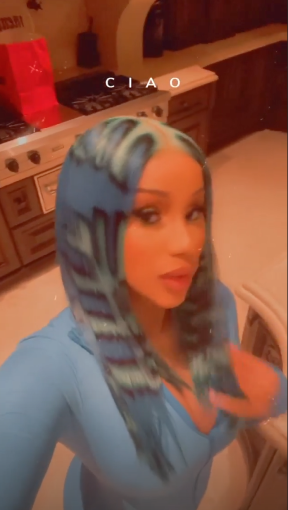 Cardi B wore a neon blue wig with puzzle piece-style highlights to a haunted house