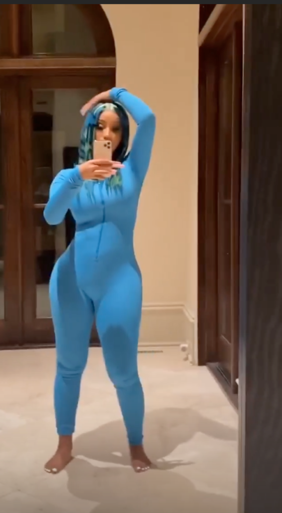 Cardi B wore a neon blue wig with puzzle piece-style highlights to a haunted house
