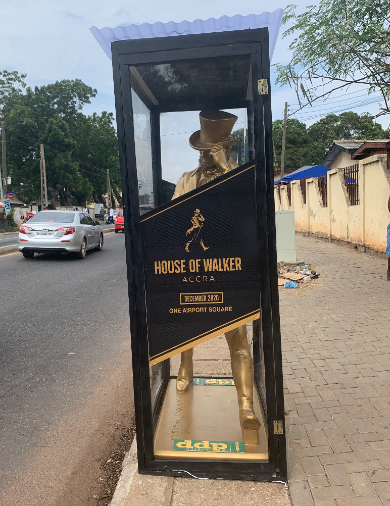 The striding man is walking across Accra!