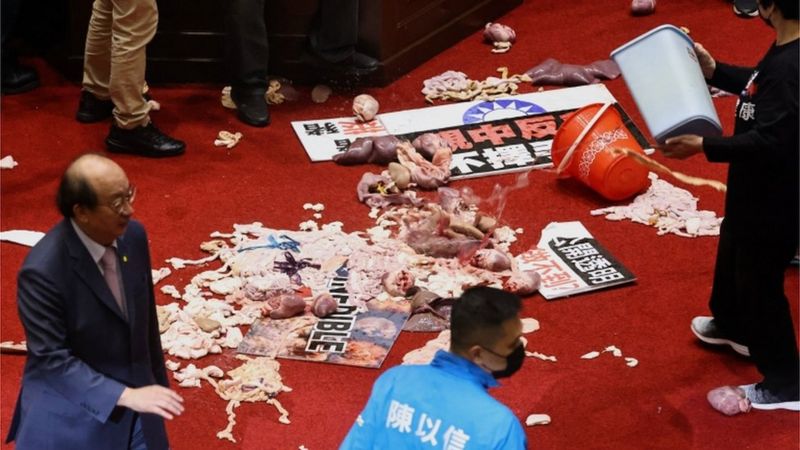 Pig guts fly as Taiwan lawmakers brawl over US pork imports