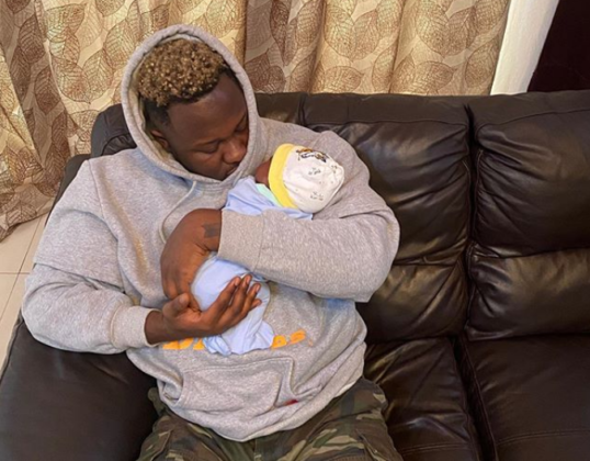 Medikal with his daughter Island