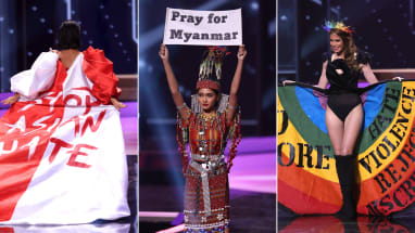 Miss Universe contestants unveil protest messages in politically charged pageant