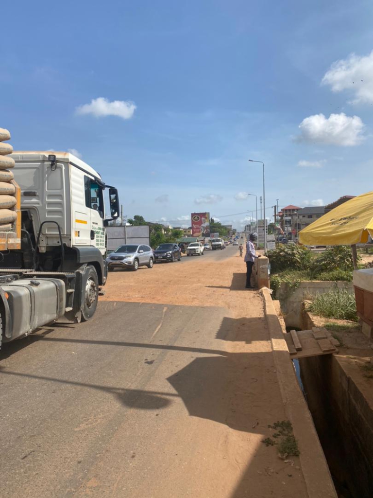 Haatso Agbogba commuters cry to government to fix a 10-meter untarred stretch causing severe traffic