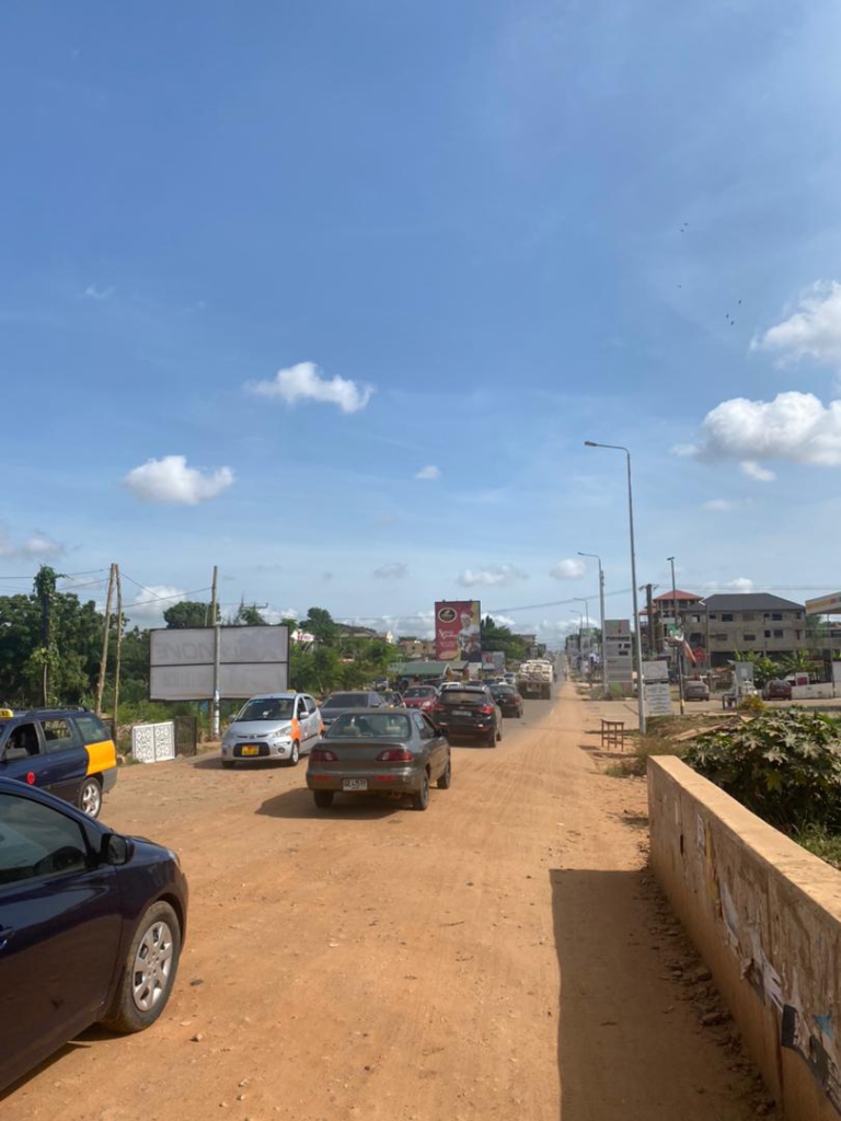 Haatso Agbogba commuters cry to government to fix a 10-meter untarred stretch causing severe traffic