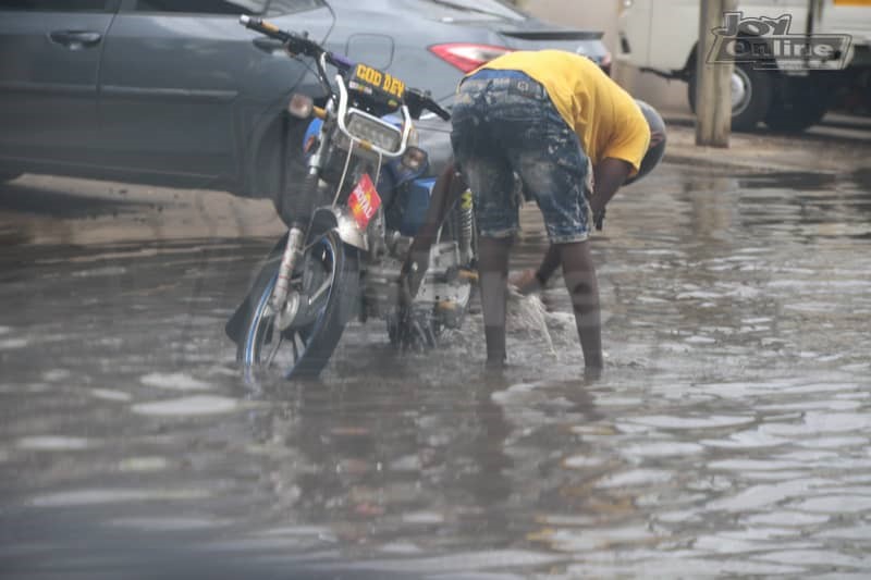 Photos: 15 minutes of rainfall throws up plastic waste from Nima gutter