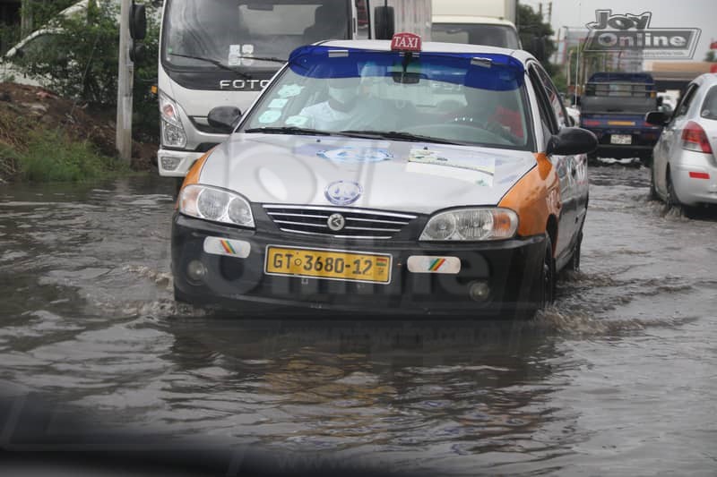 Photos: 15 minutes of rainfall throws up plastic waste from Nima gutter