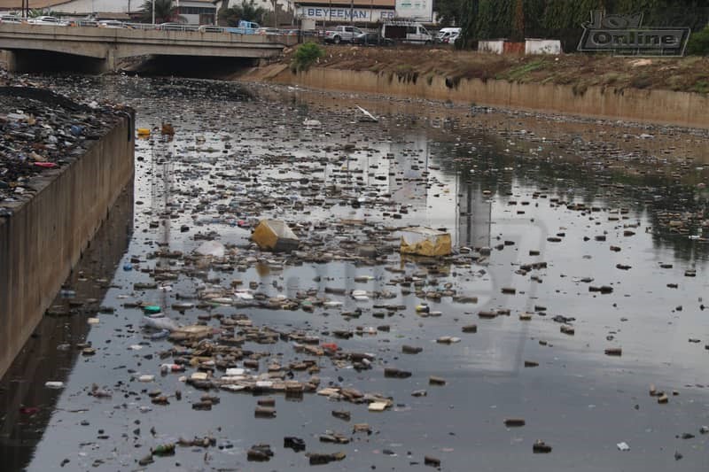 Photos: 15 minutes of rainfall throws up plastic waste from Nima gutter