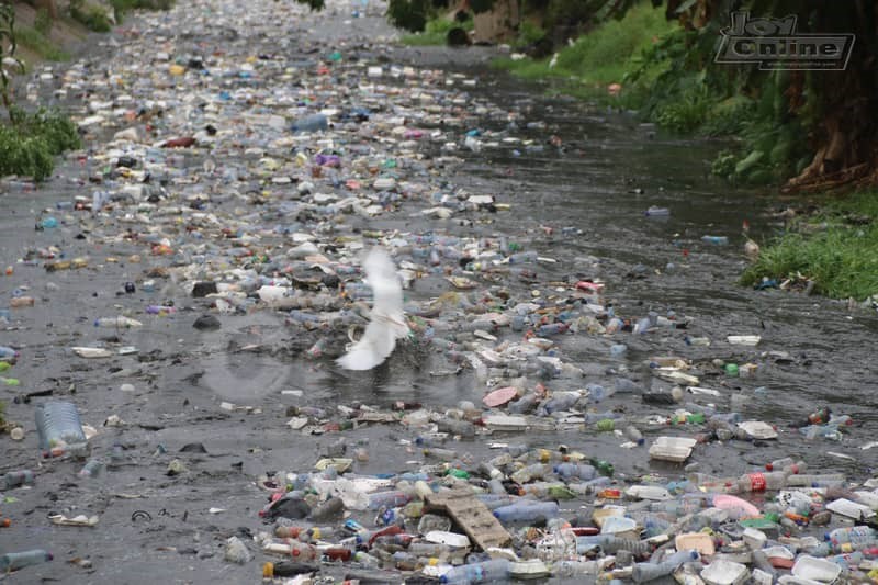 Photos: 15 minutes of rainfall throws up plastic waste from Nima gutter