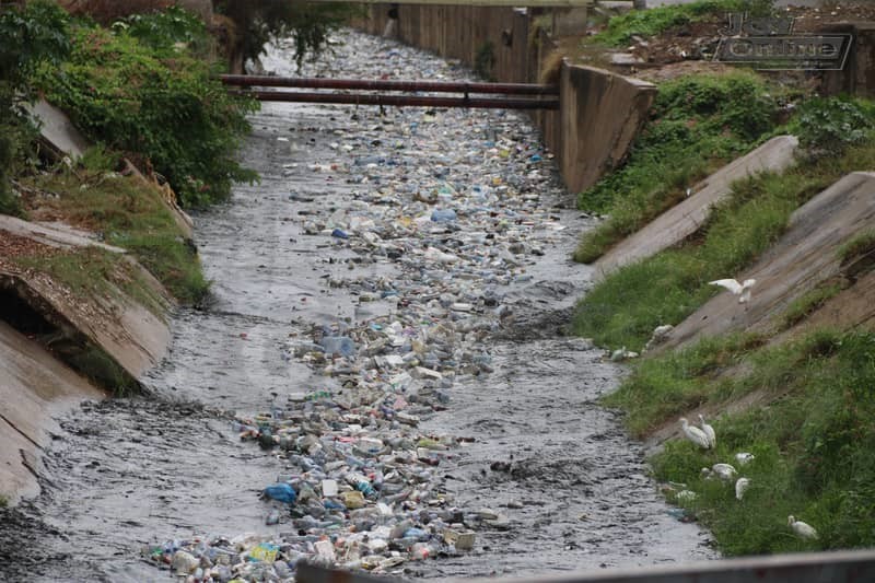 Photos: 15 minutes of rainfall throws up plastic waste from Nima gutter