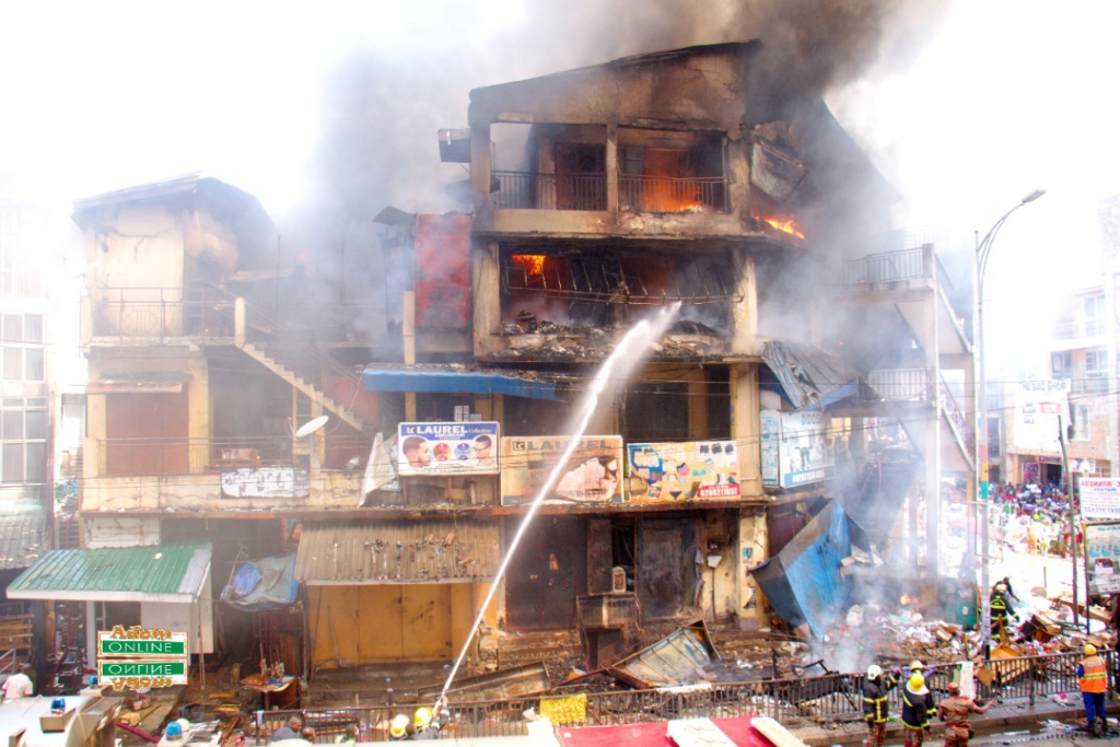 Photos: Fire destroys shops at Makola market