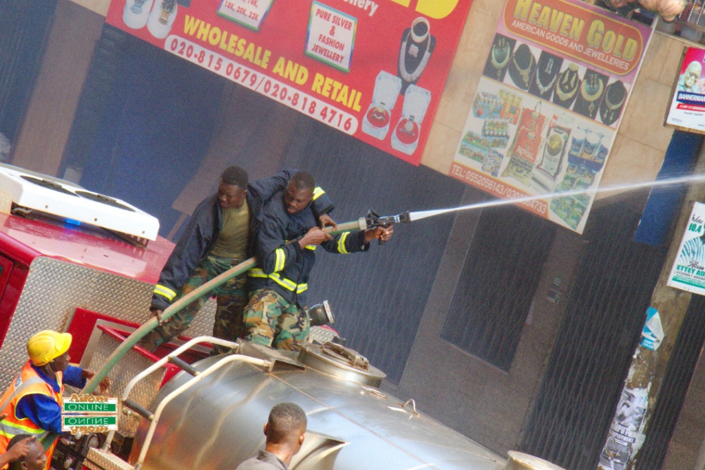 Photos: Fire destroys shops at Makola market