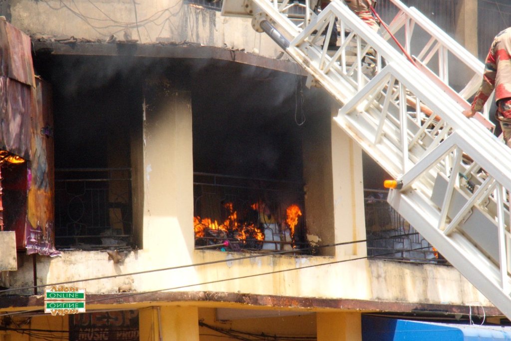 Photos: Fire destroys shops at Makola market