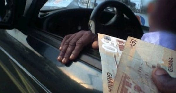 Driver bribes police