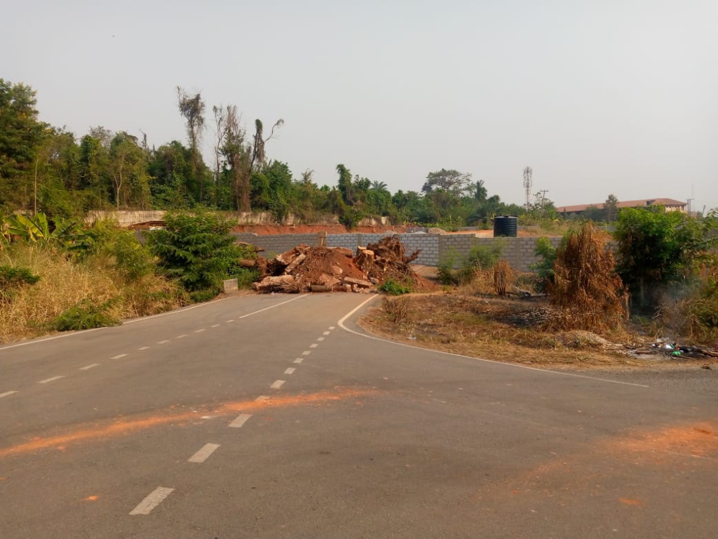 Private developer destroys asphalted road to build behind President's residence