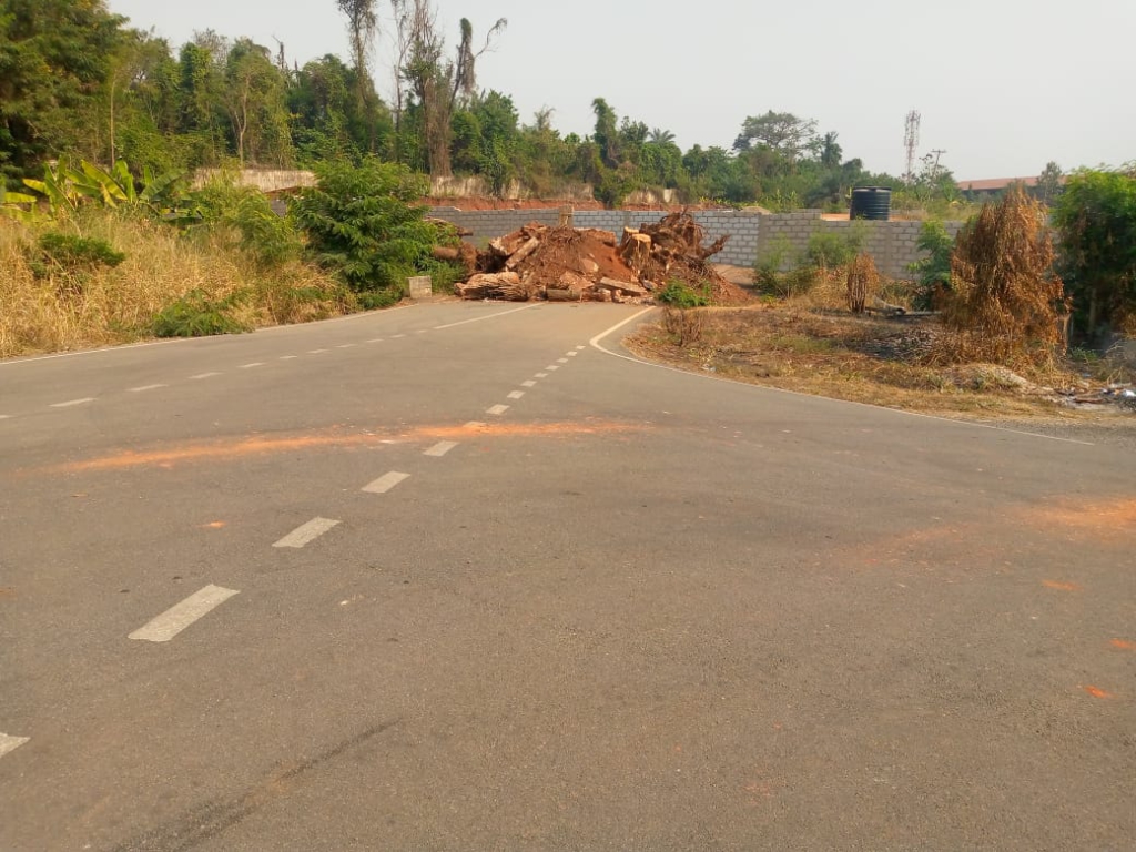 Private developer destroys asphalted road to build behind President's residence