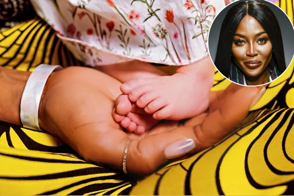 Naomi Campbell poses with baby girl on British Vogue cover