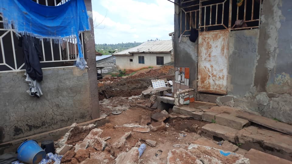 Woman killed as mining pit dug under house collapses