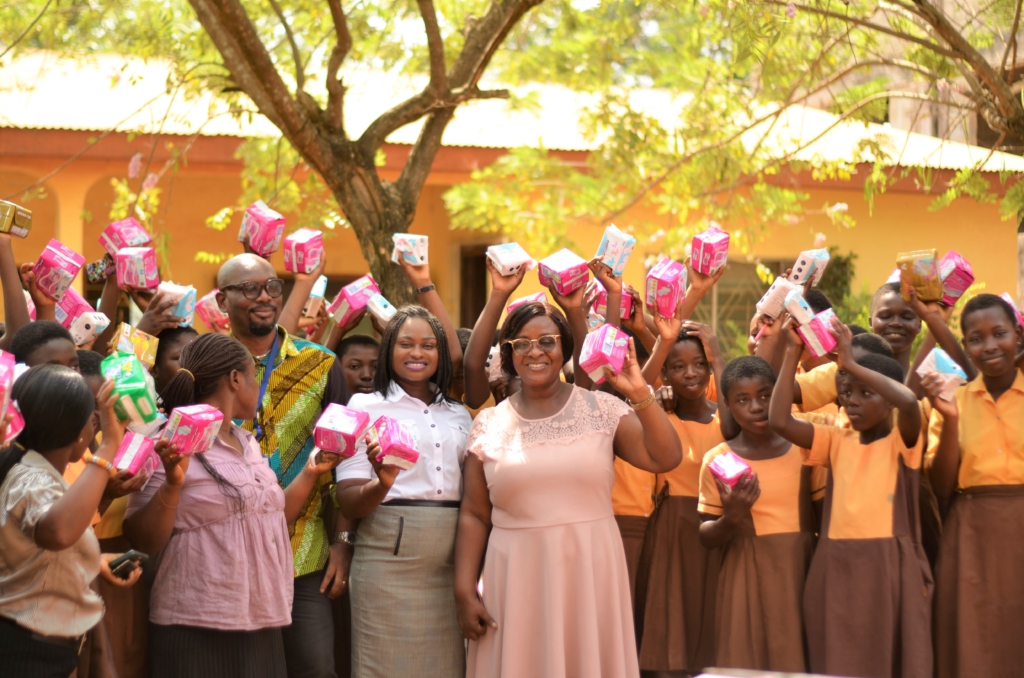LUV FM's morning show team distributes about 1,000 pieces of sanitary pads to needy girls