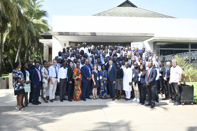 Participants in a group photo with officials of the project