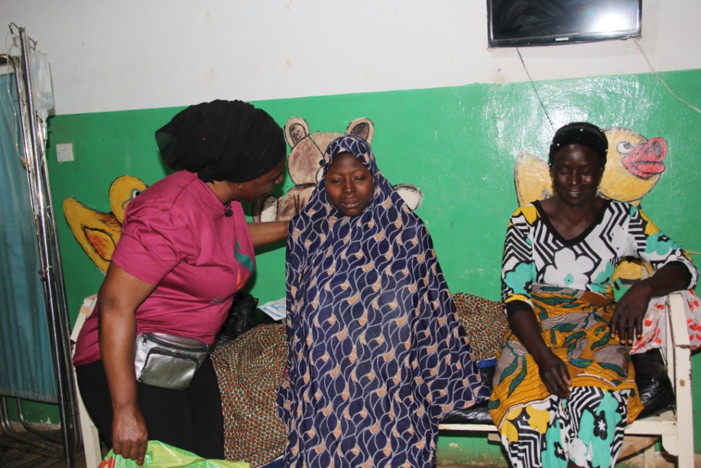 Sung Bie'la gives baby items to mothers at health facilities in Bawku