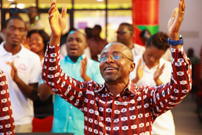 Things are getting better - Staff of The Multimedia Group sing in praise of God at thanksgiving feast