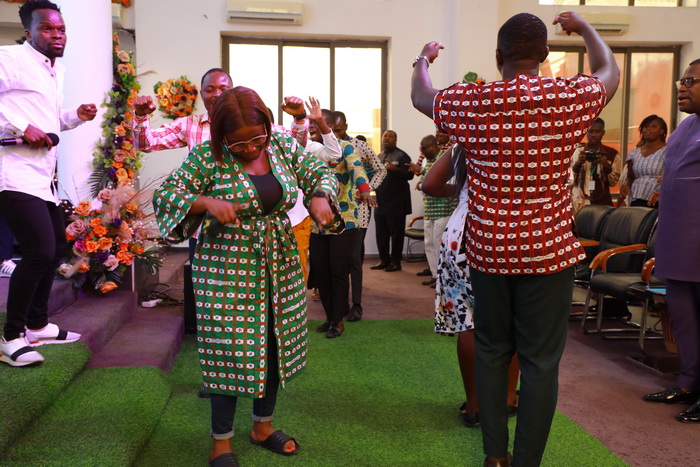 Things are getting better - Staff of The Multimedia Group sing in praise of God at thanksgiving feast