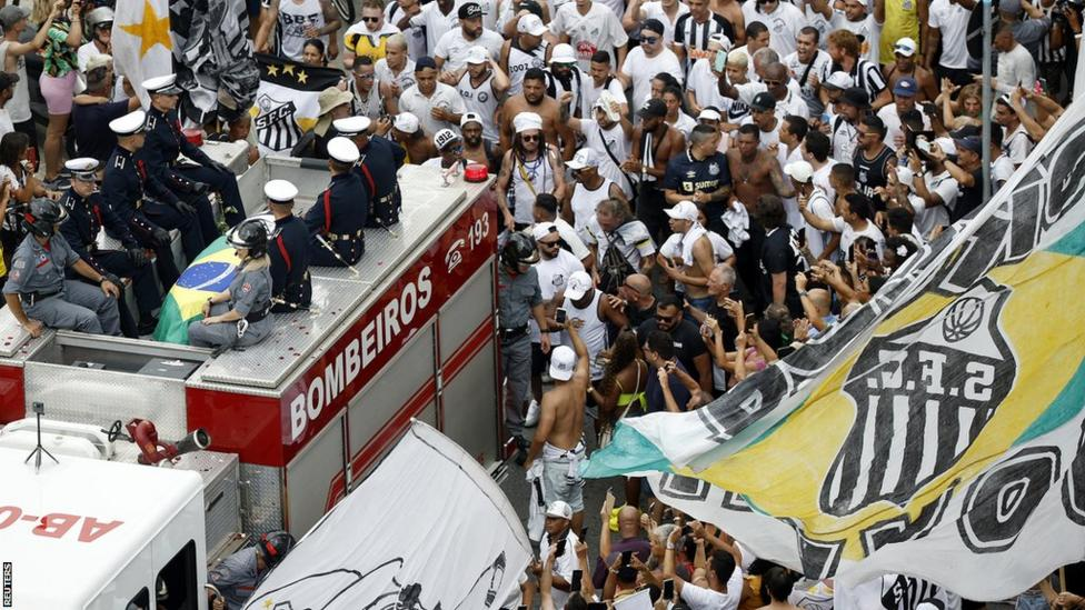 Thousands line streets of Santos as Brazil Pele is laid to rest