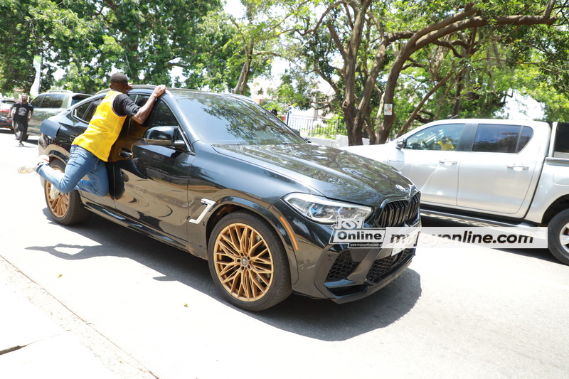 Fan risks life hanging on Adebayor's speeding car to meet him