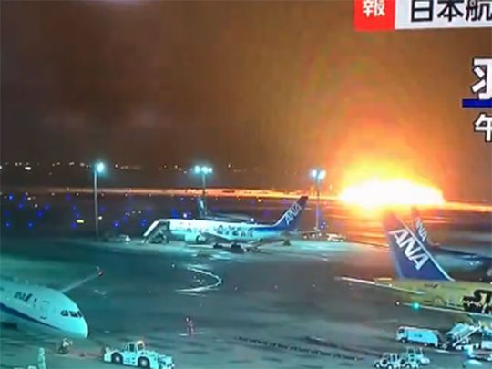 Hundreds flee burning Japan Airlines plane on Tokyo's Haneda Airport runway
