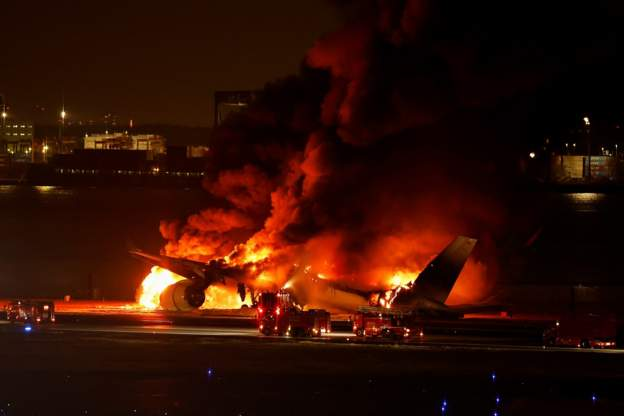 Hundreds flee burning Japan Airlines plane on Tokyo's Haneda Airport runway