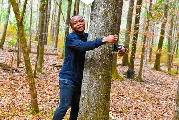 Ghanaian activist hugs over 1,100 trees in an hour to set Guinness World Records