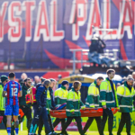 Mateta carried off with head injury after 'reckless challenge'