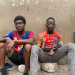 Two arrested for allegedly stealing goods from shops gutted by fire at Adum