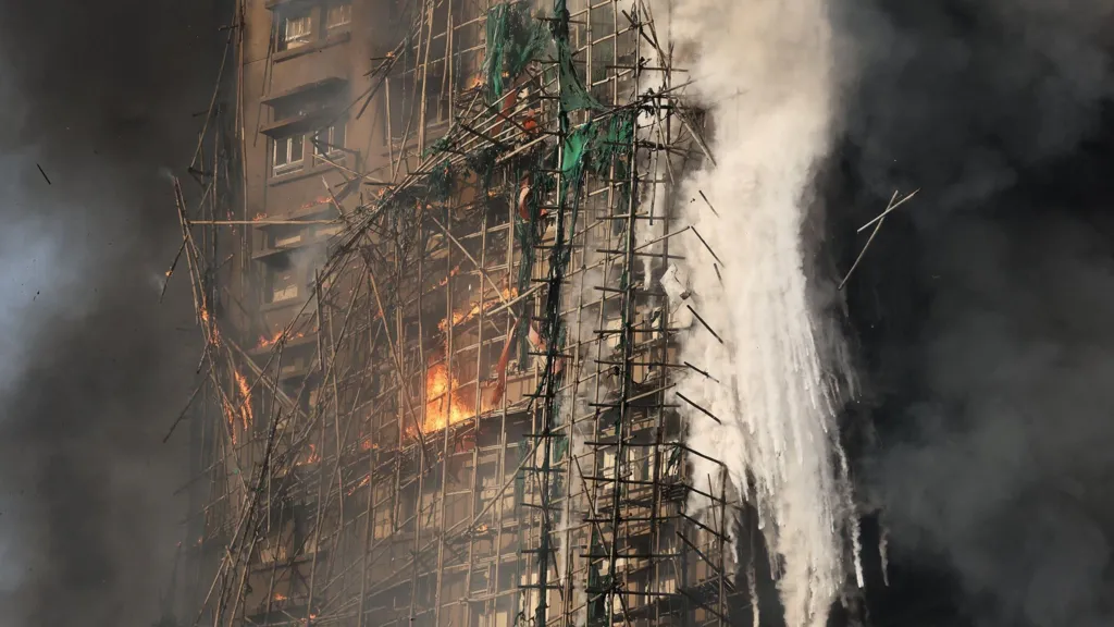 Firefighters search for hundreds still missing in devastating Hong Kong tower blocks fire