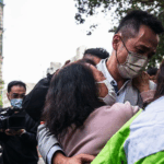 'Hang in there': Agonising wait for the missing after Hong Kong blaze