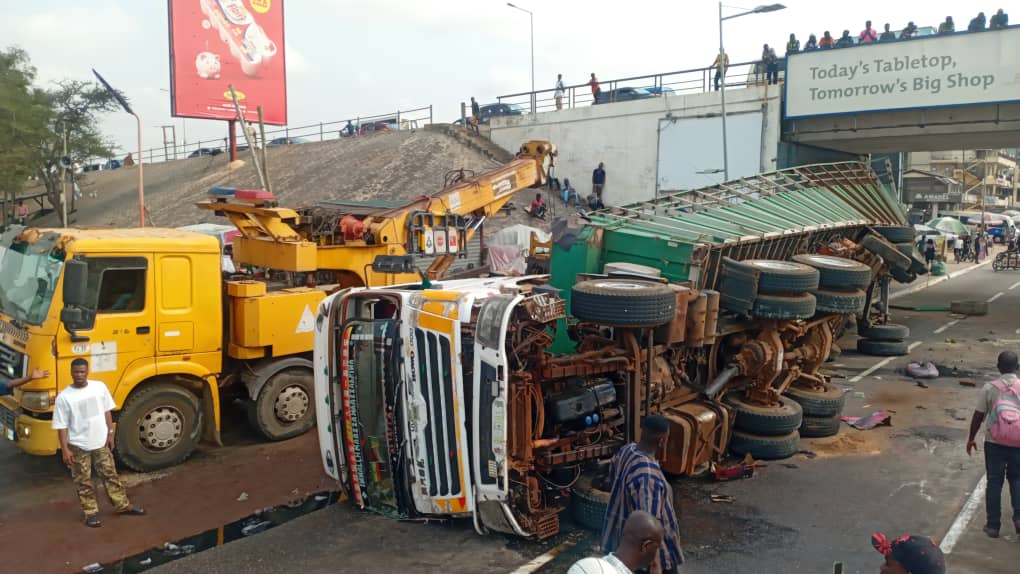 Cargo truck overturns on Circle overhead,...