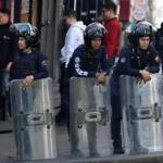 Venezuelan security forces detain journalists as armed police patrol streets