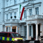 Son of Iran’s exiled late monarch urges supporters to replace embassy flags