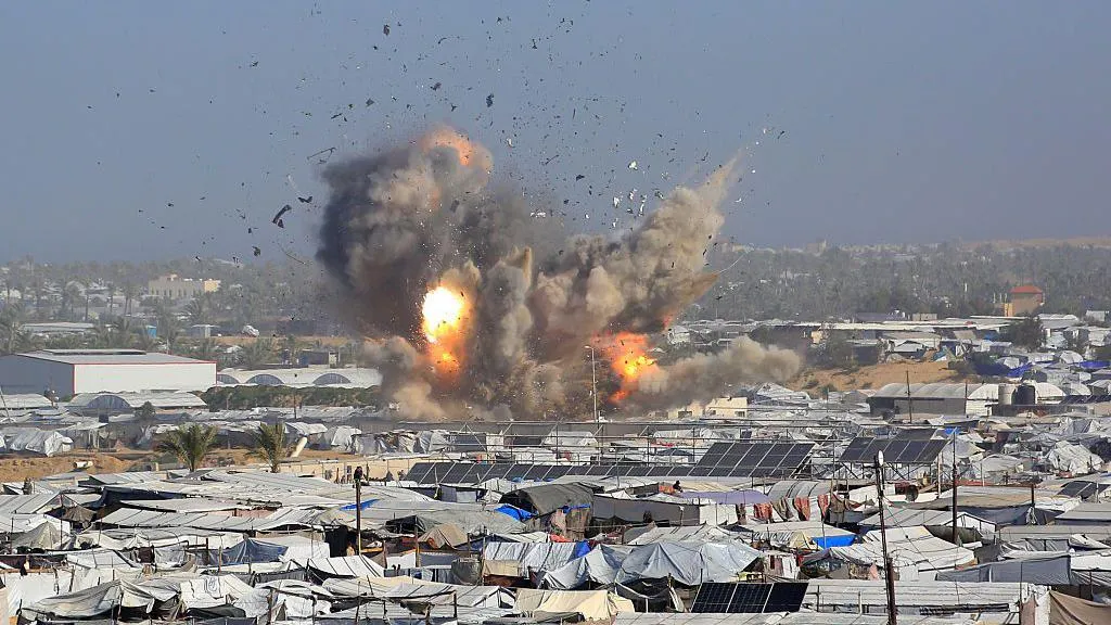 Israeli air strikes kill at least 32...