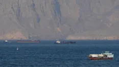 Strait of Hormuz closed again, Iran says, as ships attacked