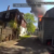 Police officer catches baby dropped from window of burning home